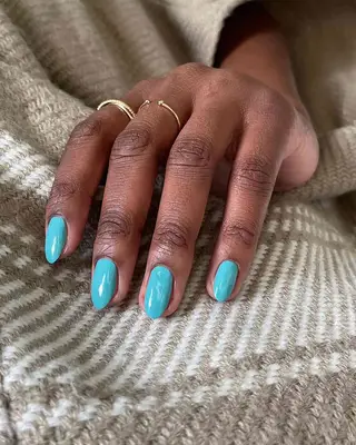 a tiffany blue solid manicure on oval nails