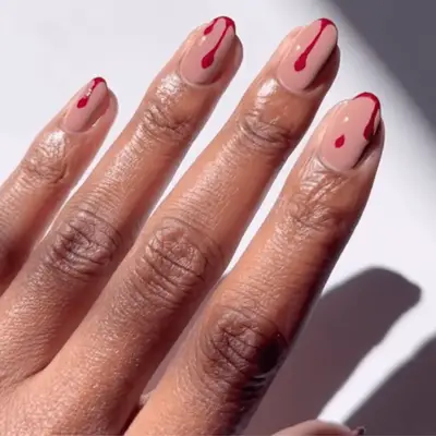 Nude manicure with red blood drips