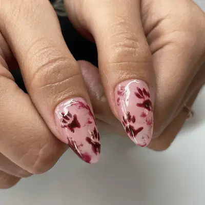 Red fingerprint crime scene nails on the thumbs