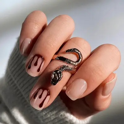 Nude short nails with dark vampy blood drips