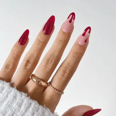 Solid red glitter nails and drippy tips