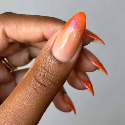 Shimmery Pumpkin spice French Tips With an Iridescent Finish 