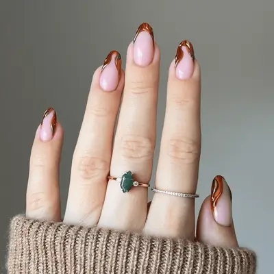A manicure in various fall shades with sweater 3D accents