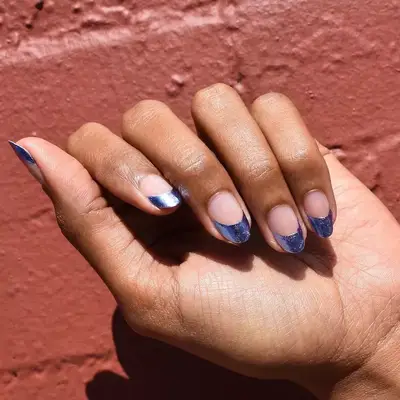 Deep blue foil French manicure design