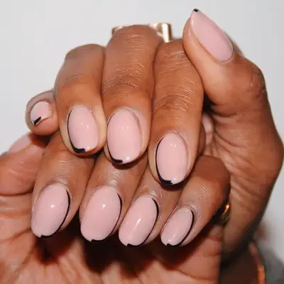 Minimalist neutral manicure with black side crescent