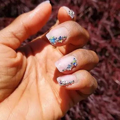 Clear manicure with bedazzled side