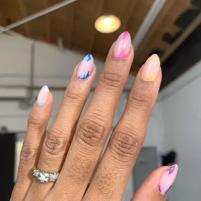 Manicure with multicolored tie dye design