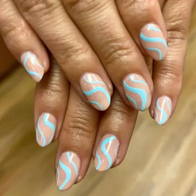 Nude nails with tiffany blue swirls