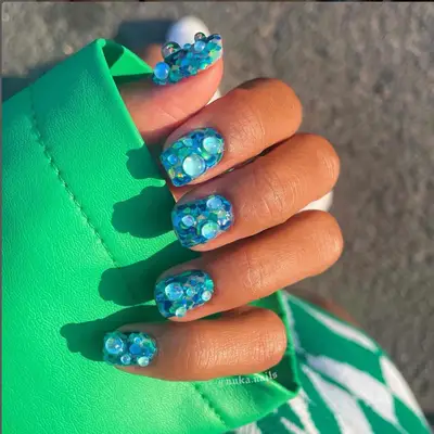Sea-glass inspired Tiffany blue nails.