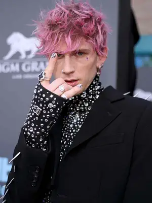 Machine Gun Kelly arrives to the 2022 Billboard Music Awards held at the MGM Grand Garden Arena on May 15, 2022. -- (Photo by Christopher Polk/NBC/NBCU Photo Bank via Getty Images)