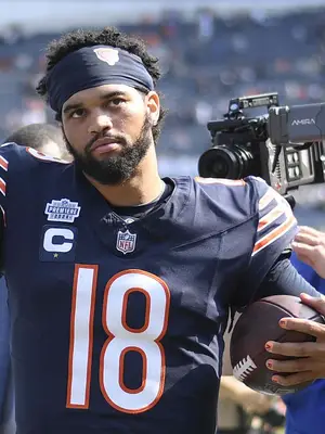 Caleb Williams #18 of the Chicago Bears celebrates after the game against the Tennessee Titans at Soldier Field on September 08, 2024 in Chicago, Illinois. The Bears defeated the Titans 24-17. (Photo by Quinn Harris/Getty Images)