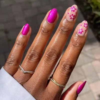 Close up of magenta hibiscus bloom nail art.