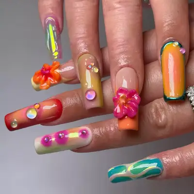 Close up of maximalist mismatched nails with 3D art and hibiscus flower.
