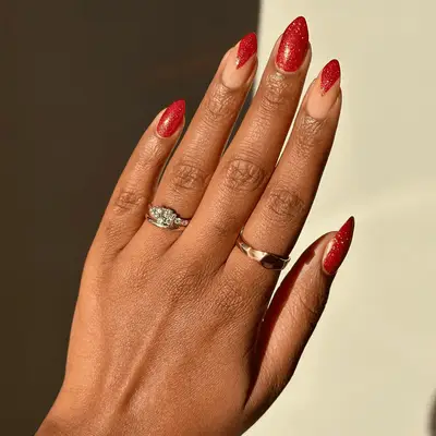 A glittery manicure with holiday light nail art