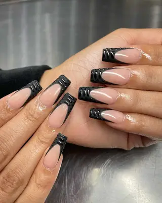 Black crocodile French tip nails.