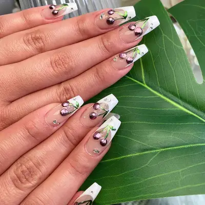 white french tipped coffin nails with cherry 3d designs and rhinestones
