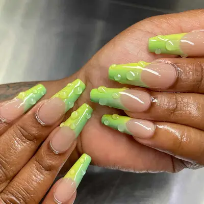 neon and light green ombre french tip coffin nails with 3d water droplets