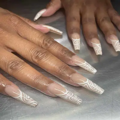 French nails with line designs.