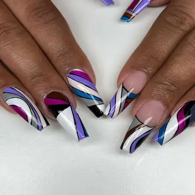 Abstract purple and multi-color nails.