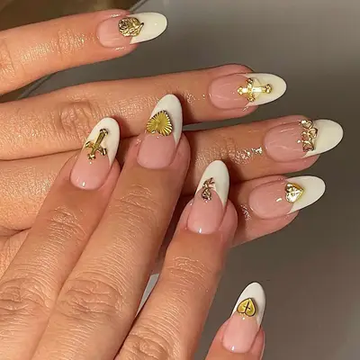 White French tips with 3D gold accents