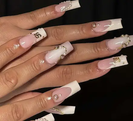 french manicure with pearls and rhinestones at tips