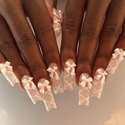 Long square nails with lace-up detail and bows