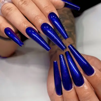Extra long blue sparkly nails