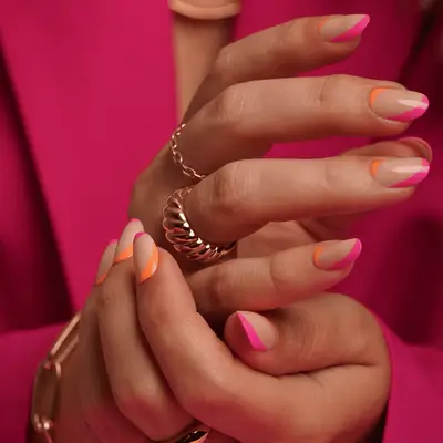 neon pink french inspired tips with neon orange cuticle trim