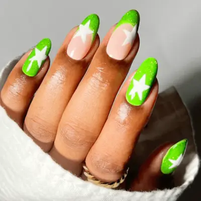 neon green french nails with white star accents