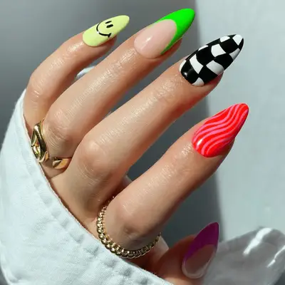 neon pink and green french tip accent nails with optical illusion nail designs