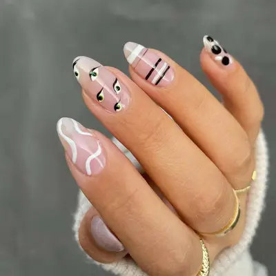 mismatched black and white manicure
