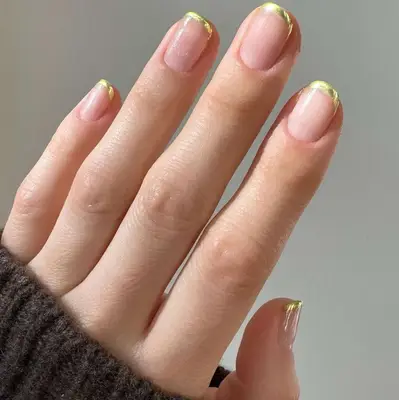 Gold French tips on short nails