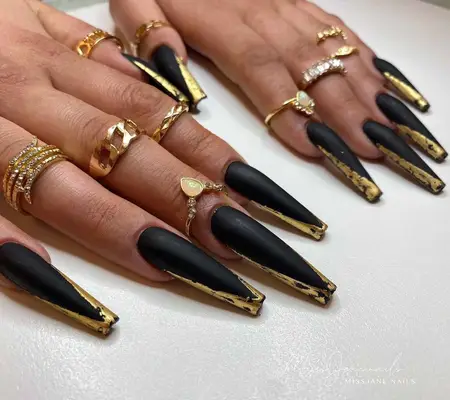 Long black and gold nails 