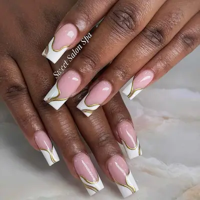 White and gold French nails 