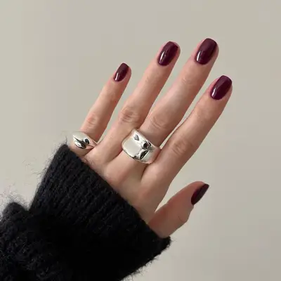 Wine red nails.