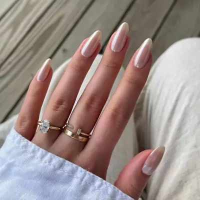 Pale pink chrome manicure.