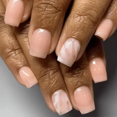 nude nails with marble accents