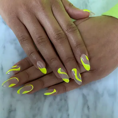 Neon yellow swirls manicure.