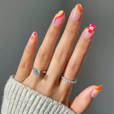 Different nail designs with pink, yellow, and orange.