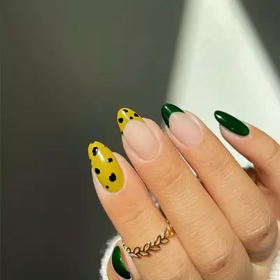 Dark green and yellow cheetah print nails.