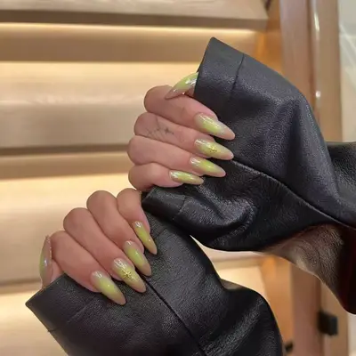 Light orange and yellow aura nails.