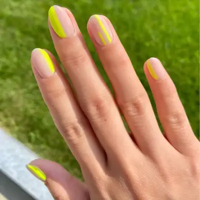 Yellow negative space manicure.