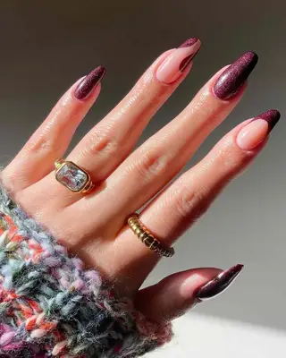 Manicure with dark purple glitter polish