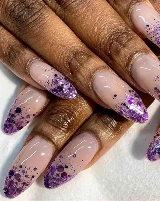 Purple glitter ombré nail design