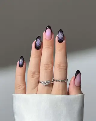 a deep purple manicure with auras and french tips