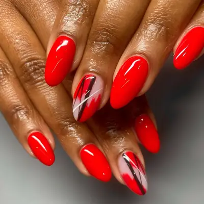 red nails with abstract middle finger design
