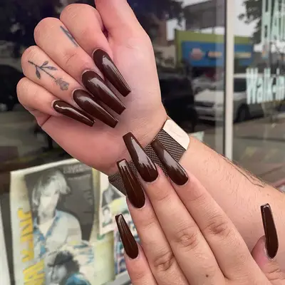 a long, dramatic solid chocolate brown mani
