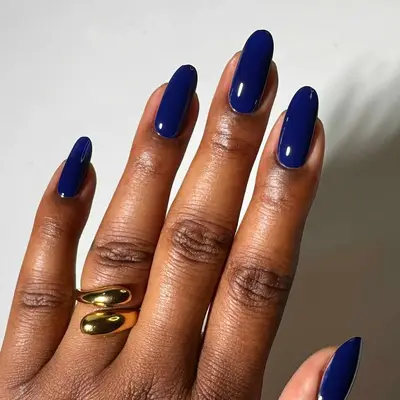 a solid dark navy blue manicure