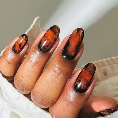 a smoky coffee manicure in brown and black