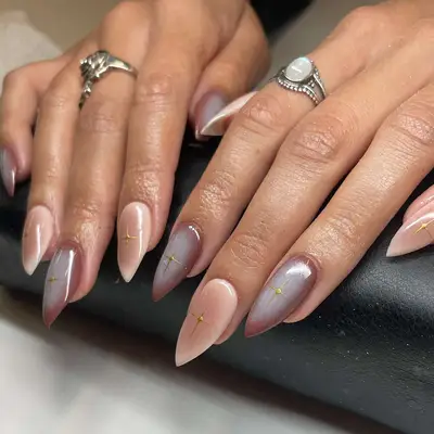 an airbrushed manicure in neutral brown